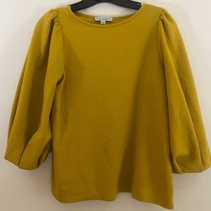 Green envelope yellow poofy sleeved shirt